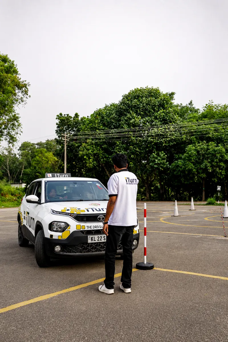 Careful, patient instruction beside an iTurn training car
